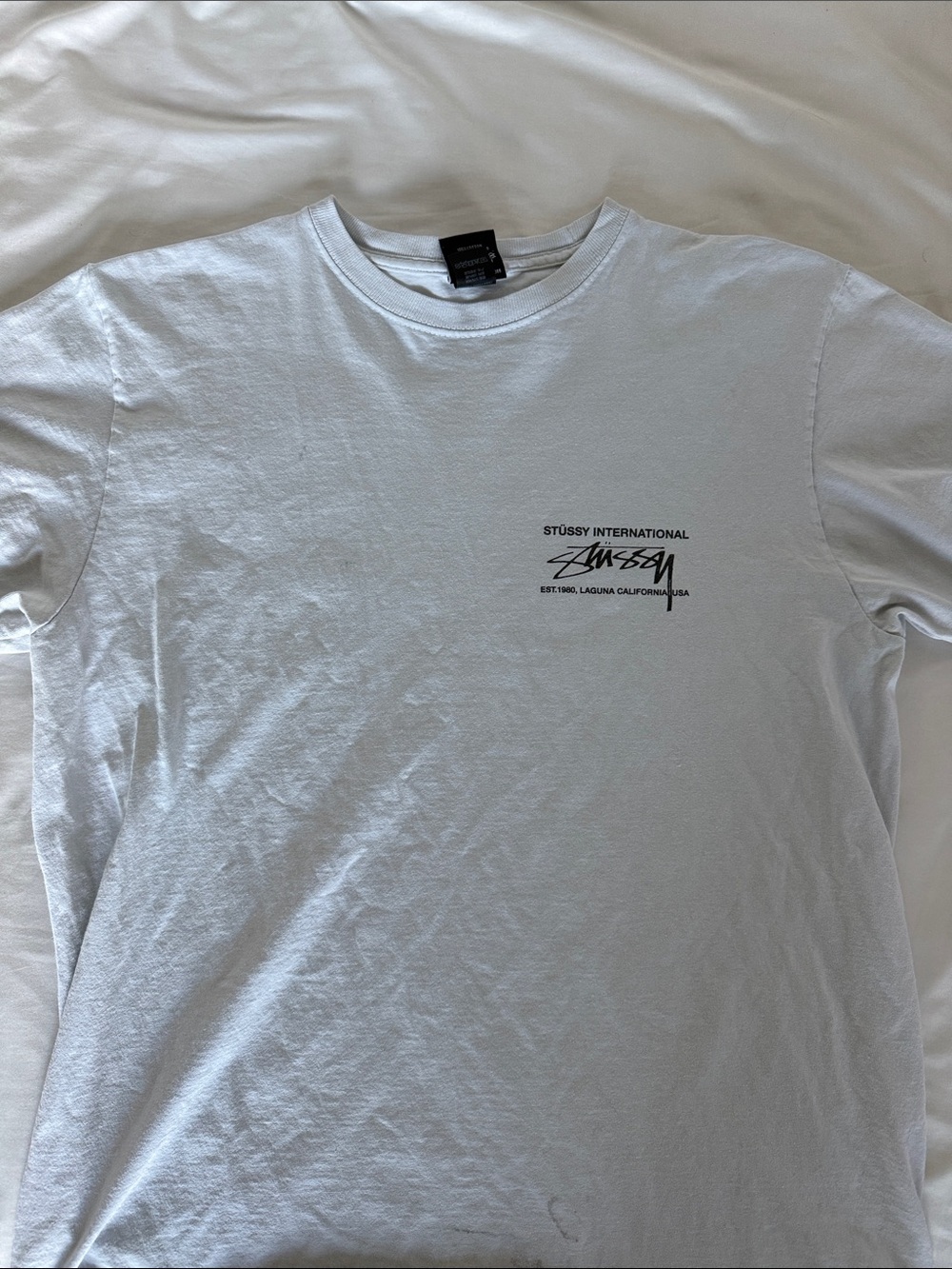 Stussy White Short Sleeve Tee with Black Chest Logo
